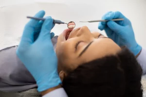 young-black-female-patient-lying-in-chair-during-d